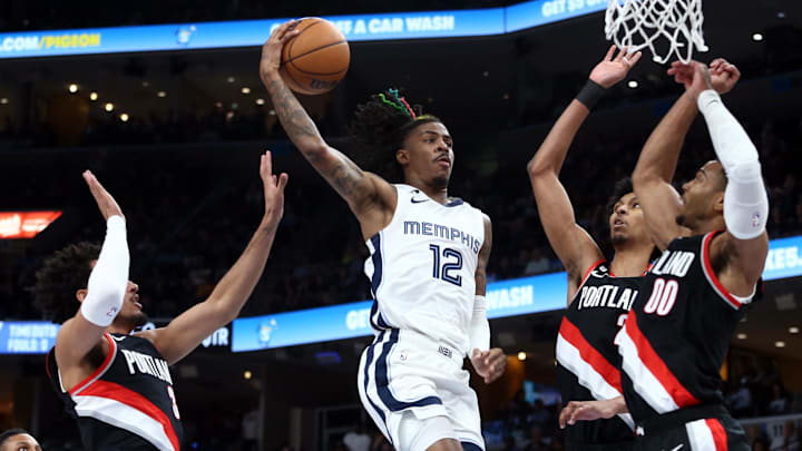 Memphis Grizzlies guard Ja Morant (12) drives to the basket during the second half against the Portland Trail Blazers at FedExForum. Mandatory Credit: Petre Thomas-Imagn Images