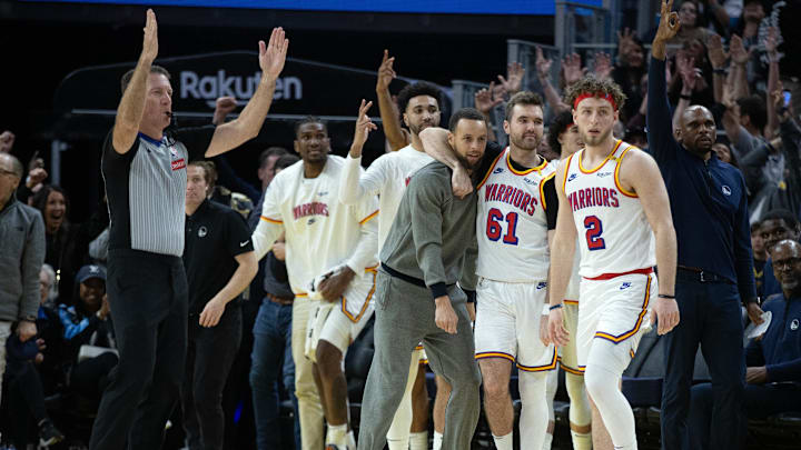 Mar 18, 2025; San Francisco, California, USA; The Golden State Warriors bench celebrates a 3-point basket against the Milwaukee Bucks during the fourth quarter at Chase Center. Mandatory Credit: D. Ross Cameron-Imagn Images