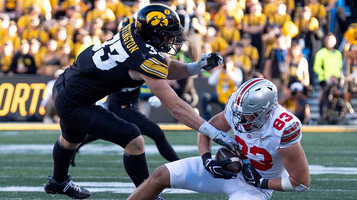 Ohio State Buckeyes tight end Nate Roberts (83) catches a pass as Iowa Hawkeyes linebacker Cam Buffington (33) defends Oct. 3, 2026 at Kinnick Stadium in Iowa City, Iowa.