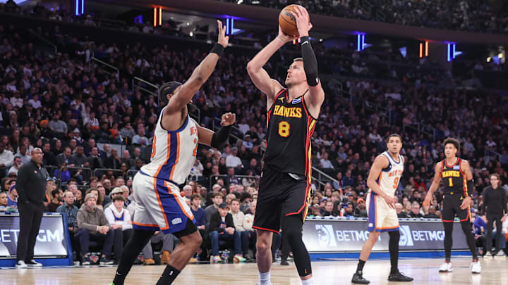 Jan 2, 2026; New York, New York, USA;  Atlanta Hawks center Kristaps Porzingis (8) shoots past New York Knicks forward Guerschon Yabusele (28) in the third quarter at Madison Square Garden. Mandatory Credit: Wendell Cruz-Imagn Images
