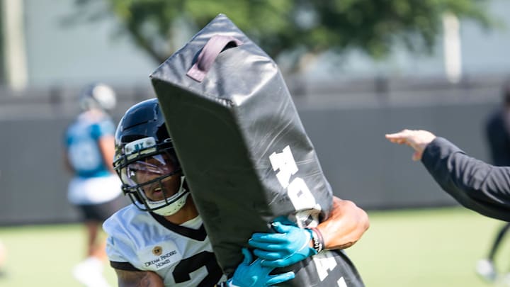 Jacksonville Jaguars cornerback Christian Braswell (21) wraps up a tackling dummy during the Jacksonville Jaguars’ third mandatory minicamp Thursday June 12, 2025 at the Miller Electric Center in Jacksonville, Fla. [Doug Engle/Florida Times-Union]