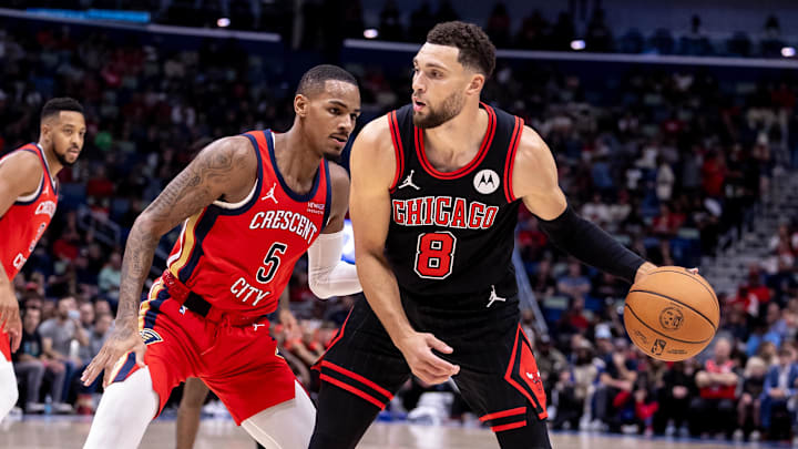 Chicago Bulls guard Zach LaVine (8) looks to pass the ball against New Orleans Pelicans guard Dejounte Murray (5) during the first half at Smoothie King Center. Mandatory Credit: Stephen Lew-Imagn Images