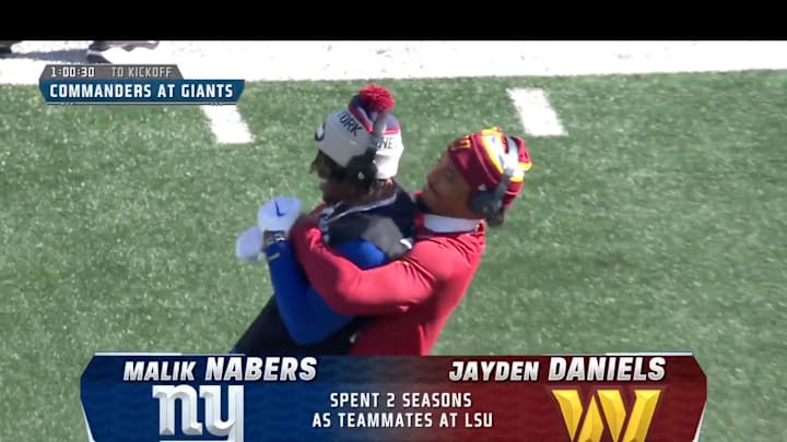 Washington Commanders quarterback Jayden Daniels hugs New York Giants receiver Malik Nabers during pre-game warm ups.