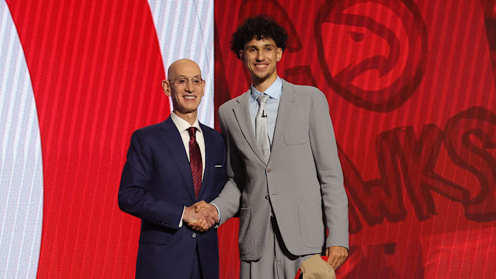 Jun 26, 2024; Brooklyn, NY, USA; Zaccharie Risacher poses for photos with NBA commissioner Adam Silver after being selected first overall by the Atlanta Hawks in the first round of the 2024 NBA Draft at Barclays Center. Mandatory Credit: Brad Penner-Imagn Images