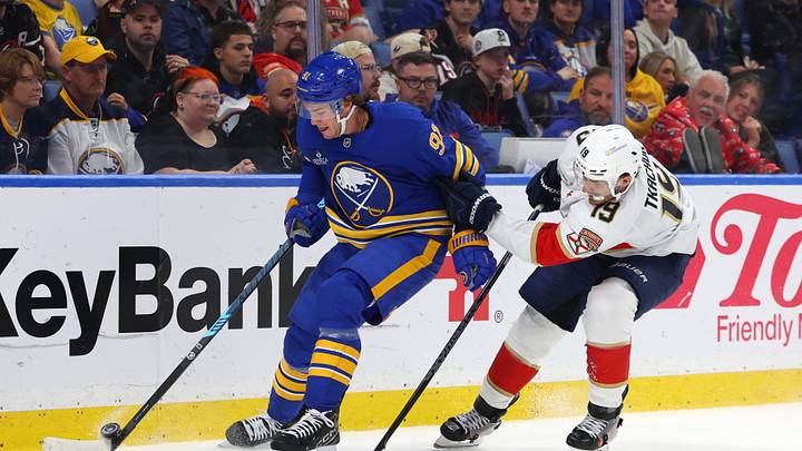 Oct 12, 2026; Buffalo, New York, USA;  Buffalo Sabres right wing Josh Doan (91) looks to control the puck as Florida Panthers left wing Matthew Tkachuk (19) defends during the second period at KeyBank Center. Mandatory Credit: Timothy T. Ludwig-Imagn Images