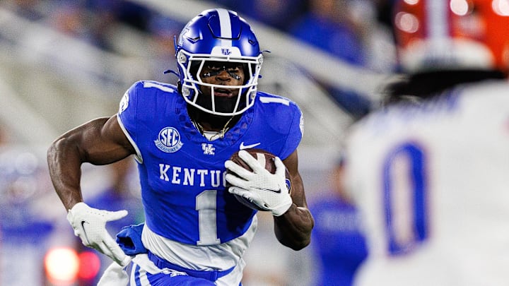 Nov 8, 2025; Lexington, Kentucky, USA; Kentucky Wildcats wide receiver Kendrick Law (1) runs the ball during the first quarter against the Florida Gators at Kroger Field. Mandatory Credit: Jordan Prather-Imagn Images