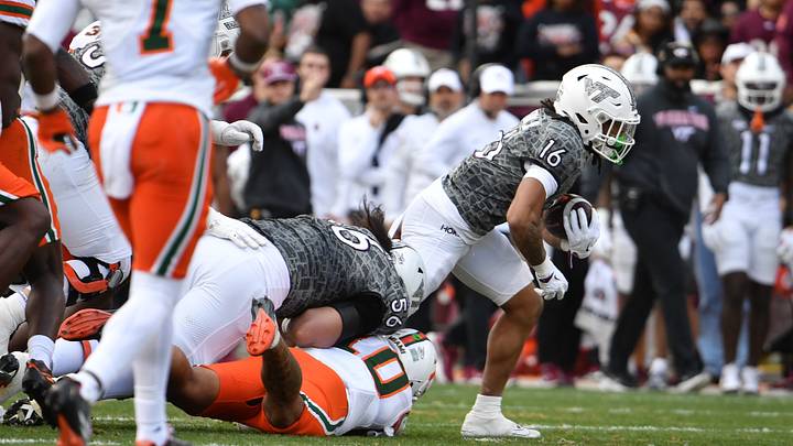 Nov 22, 2025; Blacksburg, Virginia, USA; Virginia Tech Hokies running back Jeffrey Overton (16) runs the ball during the second quarter against the Miami (FL) Hurricanes at Lane Stadium. Mandatory Credit: Brian Bishop-Imagn Images Nov 22, 2025; Blacksburg, Virginia, USA; Virginia Tech Hokies running back Jeffrey Overton (16) runs the ball during the second quarter against the Miami (FL) Hurricanes at Lane Stadium. Mandatory Credit: Brian Bishop-Imagn Images
