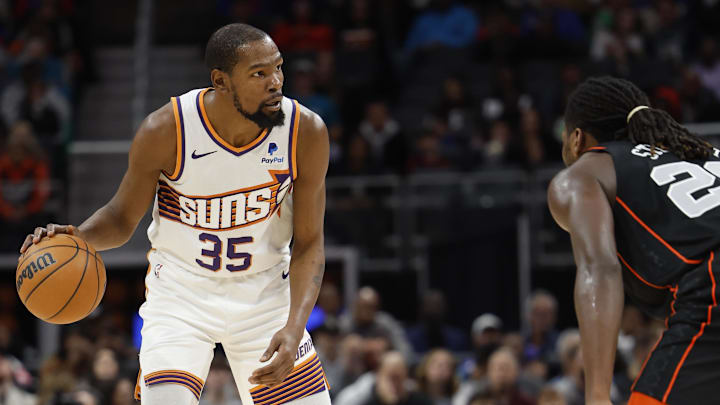 Nov 5, 2023; Detroit, Michigan, USA;  Phoenix Suns forward Kevin Durant (35) dribbles defended by Detroit Pistons center Isaiah Stewart (28) in the first half at Little Caesars Arena. Mandatory Credit: Rick Osentoski-Imagn Images