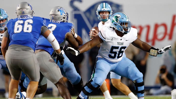Oct 13, 2023; Memphis, Tennessee, USA; Tulane Green Wave offensive linemen Shadre Hurst (56) blocks during the first half against the Memphis Tigers at Simmons Bank Liberty Stadium. 