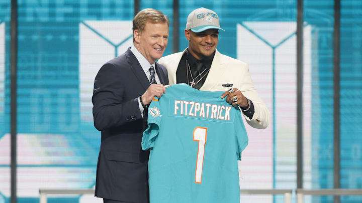 Minkah Fitzpatrick (Alabama) with NFL commissioner Roger Goodell after being selected as the number eleven overall pick to the Miami Dolphins in the first round of the 2018 NFL Draft at AT&T Stadium. 