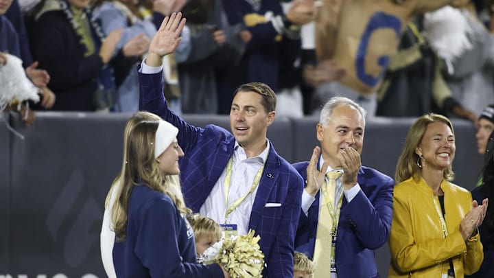 Oct 20, 2022; Atlanta, Georgia, USA; Georgia Tech Yellow Jackets athletic director J Batt is introduced on the field as president Angel Cabrera against the Virginia Cavaliers in the first half at Bobby Dodd Stadium. Mandatory Credit: Brett Davis-Imagn Images Oct 20, 2022; Atlanta, Georgia, USA; Georgia Tech Yellow Jackets athletic director J Batt is introduced on the field as president Angel Cabrera against the Virginia Cavaliers in the first half at Bobby Dodd Stadium. Mandatory Credit: Brett Davis-Imagn Images