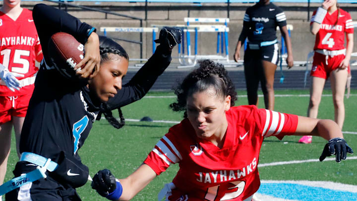Woodland Hills' Serena Bruce, attempts to elude a Jeannette defender Sunday at Woodland Hills High School.