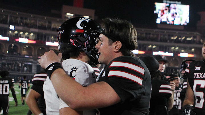 Sep 28, 2024; Lubbock, Texas, USA;  Cincinnati Bearcats quarterback Brendan Sorsby (2) and Texas Tech Red Raiders quarterback Behren Morton (2) after the game at Jones AT&T Stadium and Cody Campbell Field. Mandatory Credit: Michael C. Johnson-Imagn Images