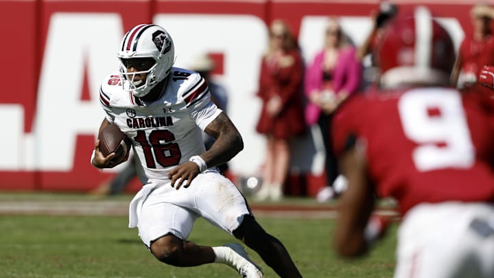 Oct 12, 2024; Tuscaloosa, Alabama, USA;  South Carolina Gamecocks quarterback LaNorris Sellers (16) scrambles for a first down against the Alabama Crimson Tide during the second half at Bryant-Denny Stadium. Mandatory Credit: Butch Dill-Imagn Images
