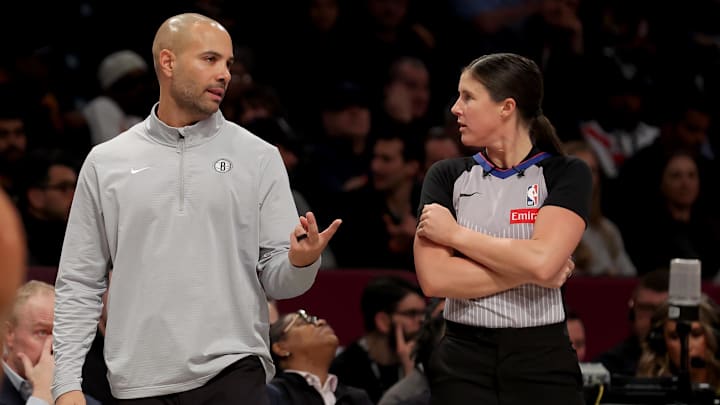 Apr 10, 2025; Brooklyn, New York, USA; Brooklyn Nets head coach Jordi Fernandez talks to referee Natalie Sago (9) during the second quarter against the Atlanta Hawks at Barclays Center. Mandatory Credit: Brad Penner-Imagn Images