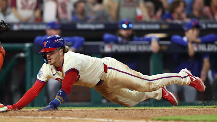 Oct 6, 2024; Philadelphia, Pennsylvania, USA; Philadelphia Phillies second base Bryson Stott (5) scores a run in the eighth inning against the New York Mets during game two of the NLDS for the 2024 MLB Playoffs at Citizens Bank Park. Oct 6, 2024; Philadelphia, Pennsylvania, USA; Philadelphia Phillies second base Bryson Stott (5) scores a run in the eighth inning against the New York Mets during game two of the NLDS for the 2024 MLB Playoffs at Citizens Bank Park.
