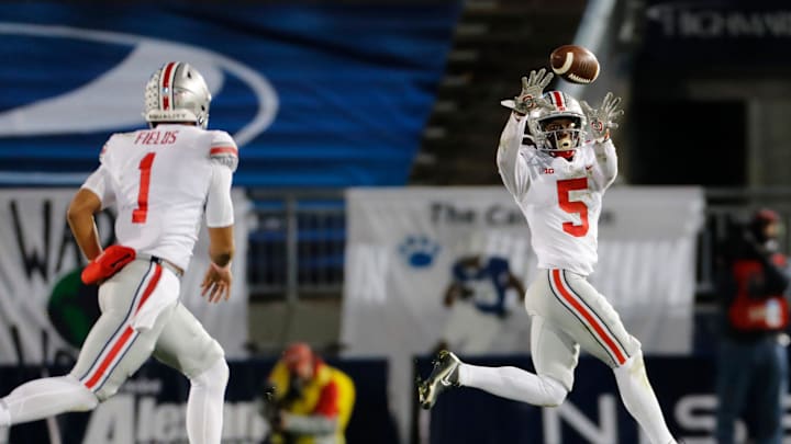 Ohio State Buckeyes quarterback Justin Fields (1) throws a pass to wide receiver Garrett Wilson (5) during the NCAA football game at Beaver Stadium in University Park, Pa. on Sunday, Nov. 1, 2020.

Ohio State Faces Penn State In Happy Valley