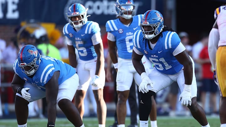 Sep 27, 2025; Oxford, Mississippi, USA; Mississippi Rebels offensive lineman Delano Townsend (51) and offensive lineman Diego Pounds (61) wait for the snap during the third quarter against the LSU Tigers at Vaught-Hemingway Stadium. Mandatory Credit: Petre Thomas-Imagn Images