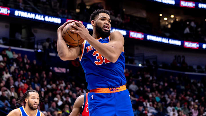 Dec 21, 2024; New Orleans, Louisiana, USA;  New York Knicks center Karl-Anthony Towns (32) grabs a rebound against the New Orleans Pelicans during the second half at Smoothie King Center. Mandatory Credit: Stephen Lew-Imagn Images