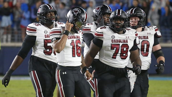 Nov 1, 2025; Oxford, Mississippi, USA; South Carolina Gamecocks quarterback LaNorris Sellers (16) and the rest of the offense walk off the field after a turnover during the fourth quarter against the Mississippi Rebels at Vaught-Hemingway Stadium. Mandatory Credit: Petre Thomas-Imagn Images
