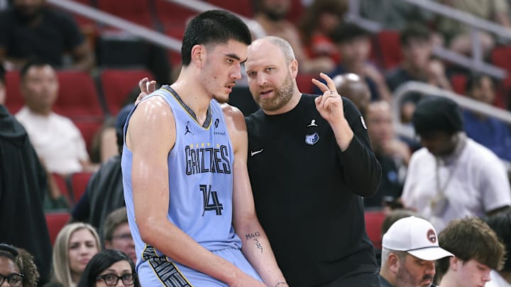 Memphis Grizzlies head coach Taylor Jenkins talks with center Zach Edey (14) during the fourth quarter against the Houston Rockets at Toyota Center. Memphis Grizzlies head coach Taylor Jenkins talks with center Zach Edey (14) during the fourth quarter against the Houston Rockets at Toyota Center.