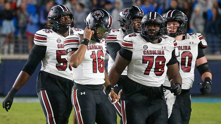 Nov 1, 2025; Oxford, Mississippi, USA; South Carolina Gamecocks quarterback LaNorris Sellers (16) and the rest of the offense walk off the field after a turnover during the fourth quarter against the Mississippi Rebels at Vaught-Hemingway Stadium. Mandatory Credit: Petre Thomas-Imagn Images