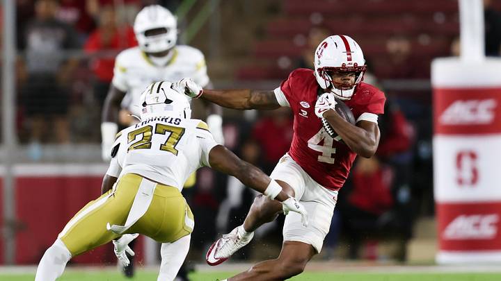 Sep 26, 2026; Stanford, California, USA;  Stanford Cardinal wide receiver Jordan Onovughe (4) runs with the ball against Georgia Tech Yellow Jackets defensive back Tae Harris (27) during the third quarter at Stanford Stadium.  Mandatory Credit: Sergio Estrada-Imagn Images