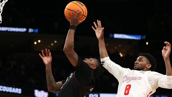 Mar 24, 2024; Memphis, TN, USA; Texas A&M Aggies guard Wade Taylor IV (4) shoots against Houston