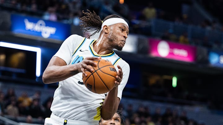 Jan 29, 2025; Indianapolis, Indiana, USA; Indiana Pacers center Myles Turner (33) rebounds the ball  in the second half against the Detroit Pistons at Gainbridge Fieldhouse. Mandatory Credit: Trevor Ruszkowski-Imagn Images