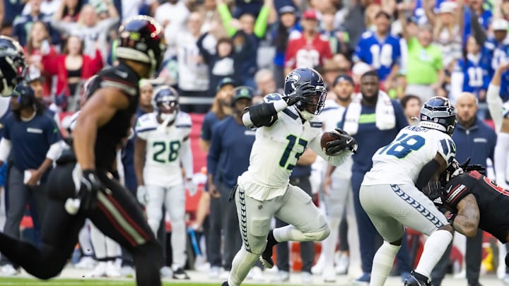 Dec 8, 2024; Glendale, Arizona, USA; Seattle Seahawks linebacker Ernest Jones IV (13) returns an interception against the Arizona Cardinals in the first half at State Farm Stadium