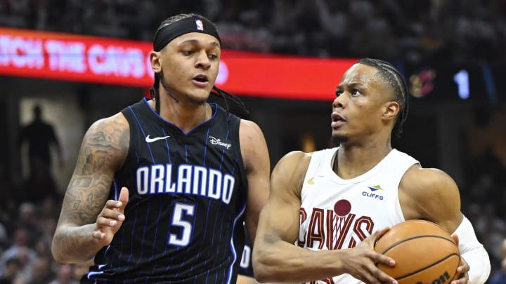 Apr 22, 2024; Cleveland, Ohio, USA; Orlando Magic forward Paolo Banchero (5) defends Cleveland Apr 22, 2024; Cleveland, Ohio, USA; Orlando Magic forward Paolo Banchero (5) defends Cleveland