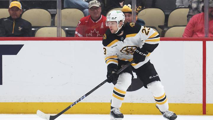 Apr 13, 2025; Pittsburgh, Pennsylvania, USA;  Boston Bruins right wing Fabian Lysell (23) skates with the puck against the Pittsburgh Penguins during the third period at PPG Paints Arena. Mandatory Credit: Charles LeClaire-Imagn Images