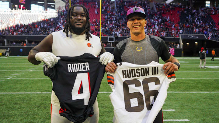 Oct 2, 2022; Atlanta, Georgia, USA; Cleveland Browns offensive tackle James Hudson III (66) swaps jerseys with Atlanta Falcons quarterback Desmond Ridder (4) after a game at Mercedes-Benz Stadium. Mandatory Credit: Brett Davis-Imagn Images
