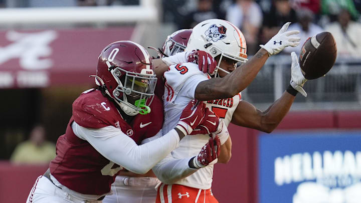 Nov 16, 2024; Tuscaloosa, AL, USA; Alabama Crimson Tide linebacker Deontae Lawson (0) and defensive back DeVonta Smith (8) break up a pass intended for Mercer Bears wide receiver Javarius George (5) at Bryant-Denny Stadium. Nov 16, 2024; Tuscaloosa, AL, USA; Alabama Crimson Tide linebacker Deontae Lawson (0) and defensive back DeVonta Smith (8) break up a pass intended for Mercer Bears wide receiver Javarius George (5) at Bryant-Denny Stadium.