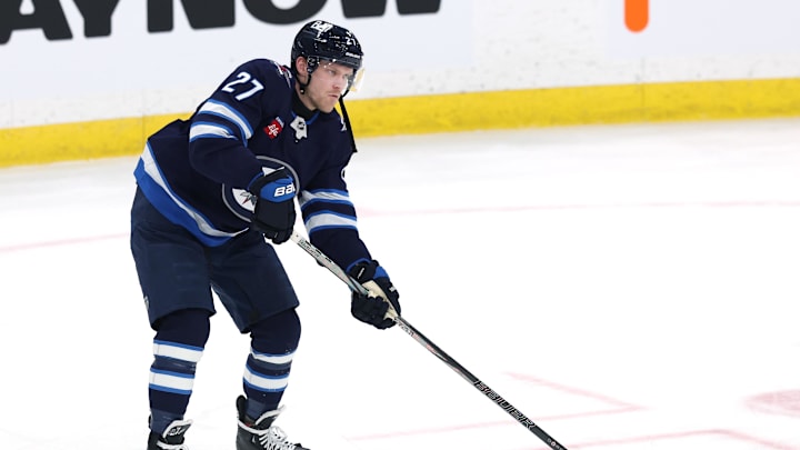 Jan 2, 2025; Winnipeg, Manitoba, CAN; Winnipeg Jets left wing Nikolaj Ehlers (27) warms up before a game against the Anaheim Ducks at Canada Life Centre. Mandatory Credit: James Carey Lauder-Imagn Images
