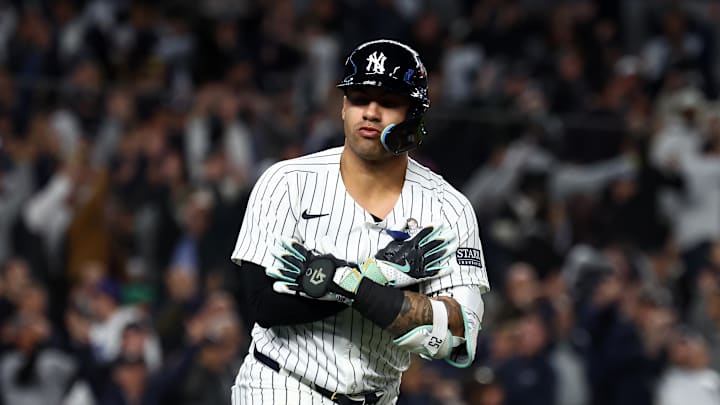 Oct 29, 2024; Bronx, New York, USA;  New York Yankees second baseman Gleyber Torres (25) reacts after hitting a three run home run against the Los Angeles Dodgers in the eighth inning during game four of the 2024 MLB World Series at Yankee Stadium. Mandatory Credit: Vincent Carchietta-Imagn Images