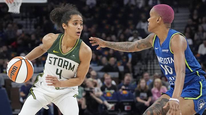Aug 28, 2025; Minneapolis, Minnesota, USA; Seattle Storm guard Skylar Diggins (4) brings the ball up against Minnesota Lynx guard Courtney Williams (10) in the first quarter at Target Center. Mandatory Credit: Bruce Kluckhohn-Imagn Images