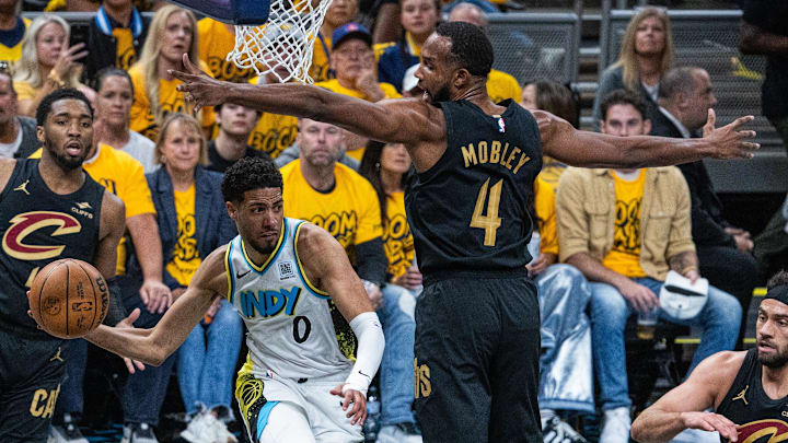 Indiana Pacers guard Tyrese Haliburton attempts to pass around Cleveland Cavaliers' Evan Mobley.