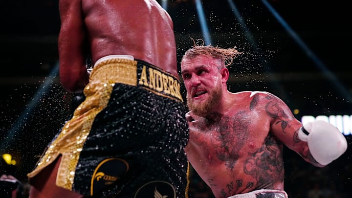 Jake Paul punches Anderson Silva during a bout at Desert Diamond Arena in Glendale, Ariz. on Oct. 29, 2022.