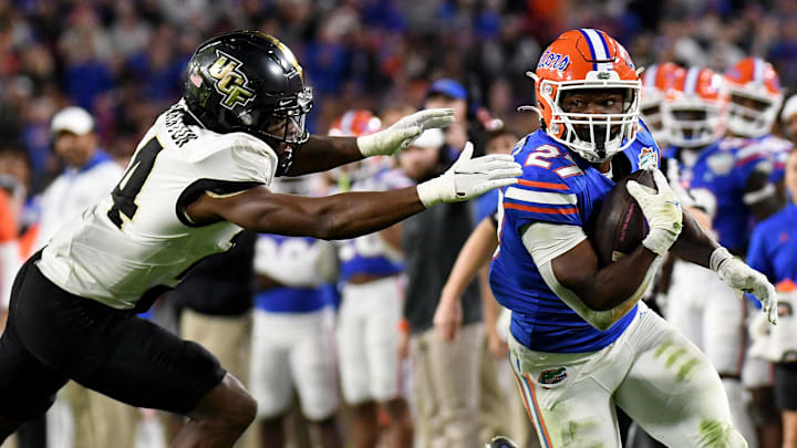 Dec 23, 2021; Tampa, FL, USA; Florida Gators running back Dameon Pierce (27) runs the ball against the UCF Knights in the first half of the Gasparilla Bowl at Raymond James Stadium. Mandatory Credit: Jonathan Dyer-Imagn Images