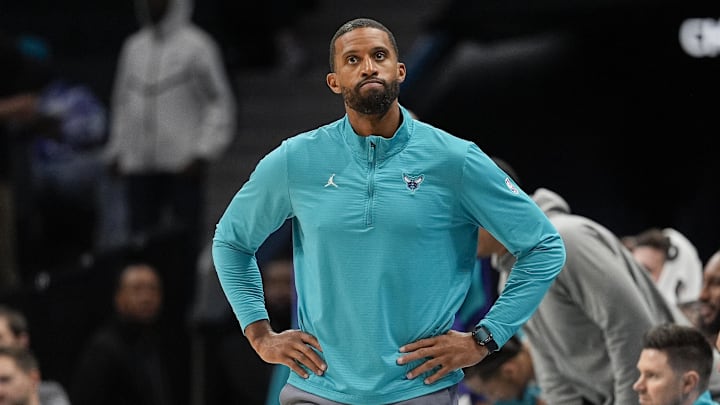 Mar 31, 2025; Charlotte, North Carolina, USA; Charlotte Hornets head coach Charles Lee looks at the scoreboard during the second half against the Utah Jazz at Spectrum Center. Mandatory Credit: Jim Dedmon-Imagn Images