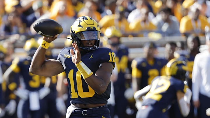 Sep 21, 2024; Ann Arbor, Michigan, USA; Michigan Wolverines quarterback Alex Orji (10) passes in the first half against the USC Trojans at Michigan Stadium. Mandatory Credit: Rick Osentoski-Imagn Images Sep 21, 2024; Ann Arbor, Michigan, USA; Michigan Wolverines quarterback Alex Orji (10) passes in the first half against the USC Trojans at Michigan Stadium. Mandatory Credit: Rick Osentoski-Imagn Images