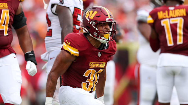 Sep 8, 2024; Tampa, Florida, USA; Washington Commanders running back Austin Ekeler (30) reacts after a run against the Tampa Bay Buccaneers in the second quarter at Raymond James Stadium. Mandatory Credit: Nathan Ray Seebeck-Imagn Images