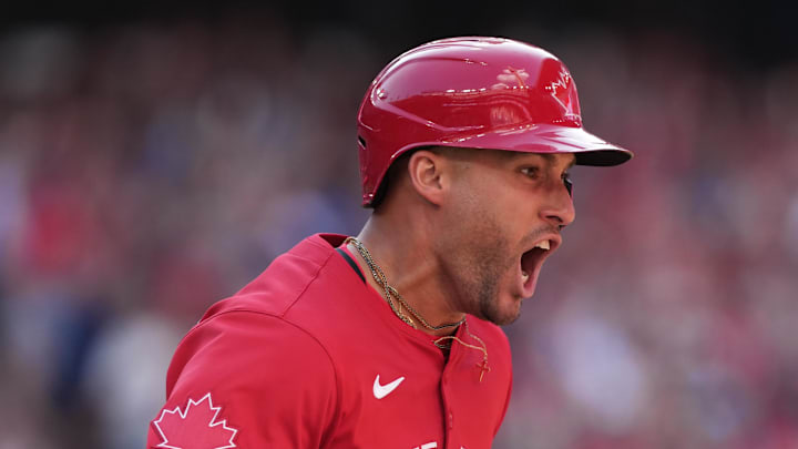 Jul 1, 2025; Toronto, Ontario, CAN;  Toronto Blue Jays right fielder George Springer (4) reacts after hitting a grand slam hone run against the New York Yankees during the seventh inning at Rogers Centre. Mandatory Credit: Nick Turchiaro-Imagn Images