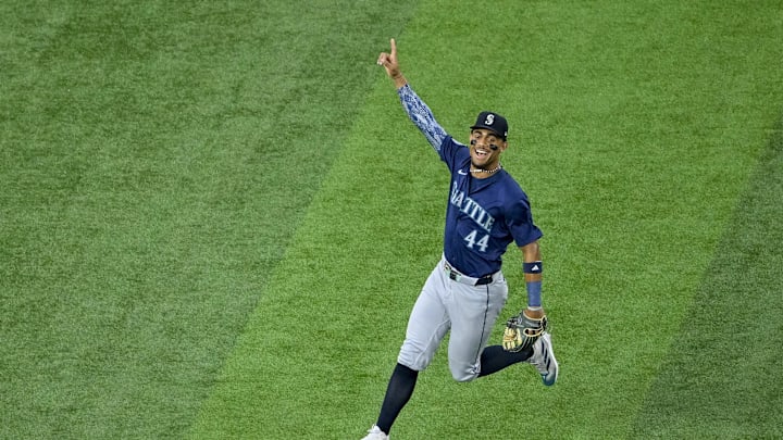 Seattle Mariners center fielder Julio Rodriguez (44) celebrates after Seattle Mariners left fielder Randy Arozarena (not pictured) makes a sliding catch on a fly ball hit by Texas Rangers shortstop Josh Smith (not pictured) during the first inning at Globe Life Field in 2024. Seattle Mariners center fielder Julio Rodriguez (44) celebrates after Seattle Mariners left fielder Randy Arozarena (not pictured) makes a sliding catch on a fly ball hit by Texas Rangers shortstop Josh Smith (not pictured) during the first inning at Globe Life Field in 2024.