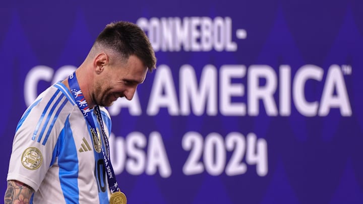 Jul 14, 2024; Miami, FL, USA; Argentina forward Lionel Messi (10) walks across the stage for the trophy presentation after beating Colombia in the Copa America Final at Hard Rock Stadium. Mandatory Credit: Nathan Ray Seebeck-Imagn Images Jul 14, 2024; Miami, FL, USA; Argentina forward Lionel Messi (10) walks across the stage for the trophy presentation after beating Colombia in the Copa America Final at Hard Rock Stadium. Mandatory Credit: Nathan Ray Seebeck-Imagn Images
