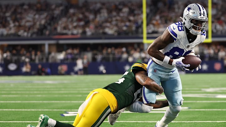 Jan 14, 2024; Arlington, Texas, USA; Dallas Cowboys wide receiver CeeDee Lamb (88) makes a catch against Green Bay Packers cornerback Corey Ballentine (35) in the first half of the 2024 NFC wild card game at AT&T Stadium. Mandatory Credit: Kevin Jairaj-USA TODAY Sports