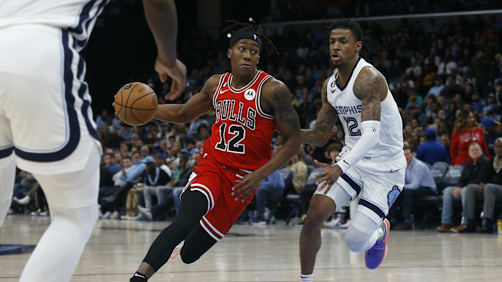 Feb 7, 2023; Memphis, Tennessee, USA; Chicago Bulls guard Ayo Dosunmu (12) dribbles as Memphis Grizzlies guard Ja Morant (12) defends during the second half at FedExForum. Mandatory Credit: Petre Thomas-Imagn Images Feb 7, 2023; Memphis, Tennessee, USA; Chicago Bulls guard Ayo Dosunmu (12) dribbles as Memphis Grizzlies guard Ja Morant (12) defends during the second half at FedExForum. Mandatory Credit: Petre Thomas-Imagn Images