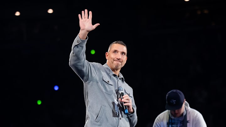 Penn State Nittany Lions football coach Matt Campbell waves to the crowd during a Big Ten wrestling match against Nebraska.