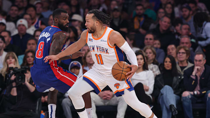 Dec 7, 2024; New York, New York, USA; New York Knicks guard Jalen Brunson (11) dribbles asDetroit Pistons forward Tim Hardaway Jr. (8) defends during the first half at Madison Square Garden. Mandatory Credit: Vincent Carchietta-Imagn Images